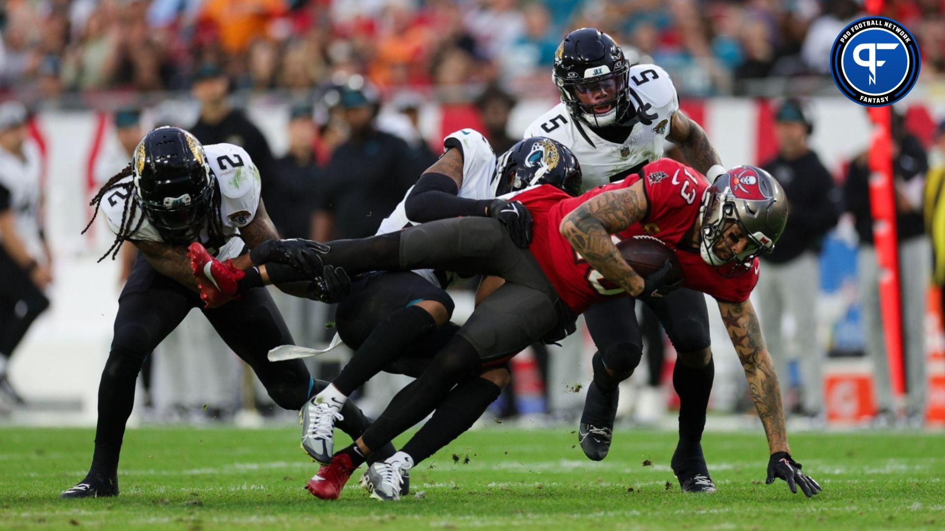 Fantasy Football WR Busts: Tampa Bay Buccaneers wide receiver Mike Evans (13) is brought down by Jacksonville Jaguars safety Rayshawn Jenkins (2) in the second quarter at Raymond James Stadium.