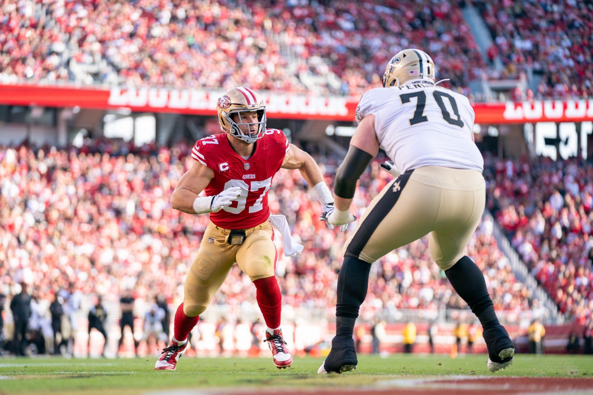 San Francisco 49ers defensive end Nick Bosa (97) rushes against New Orleans Saints tackle Trevor Penning (70) during the second quarter at Levi's Stadium.