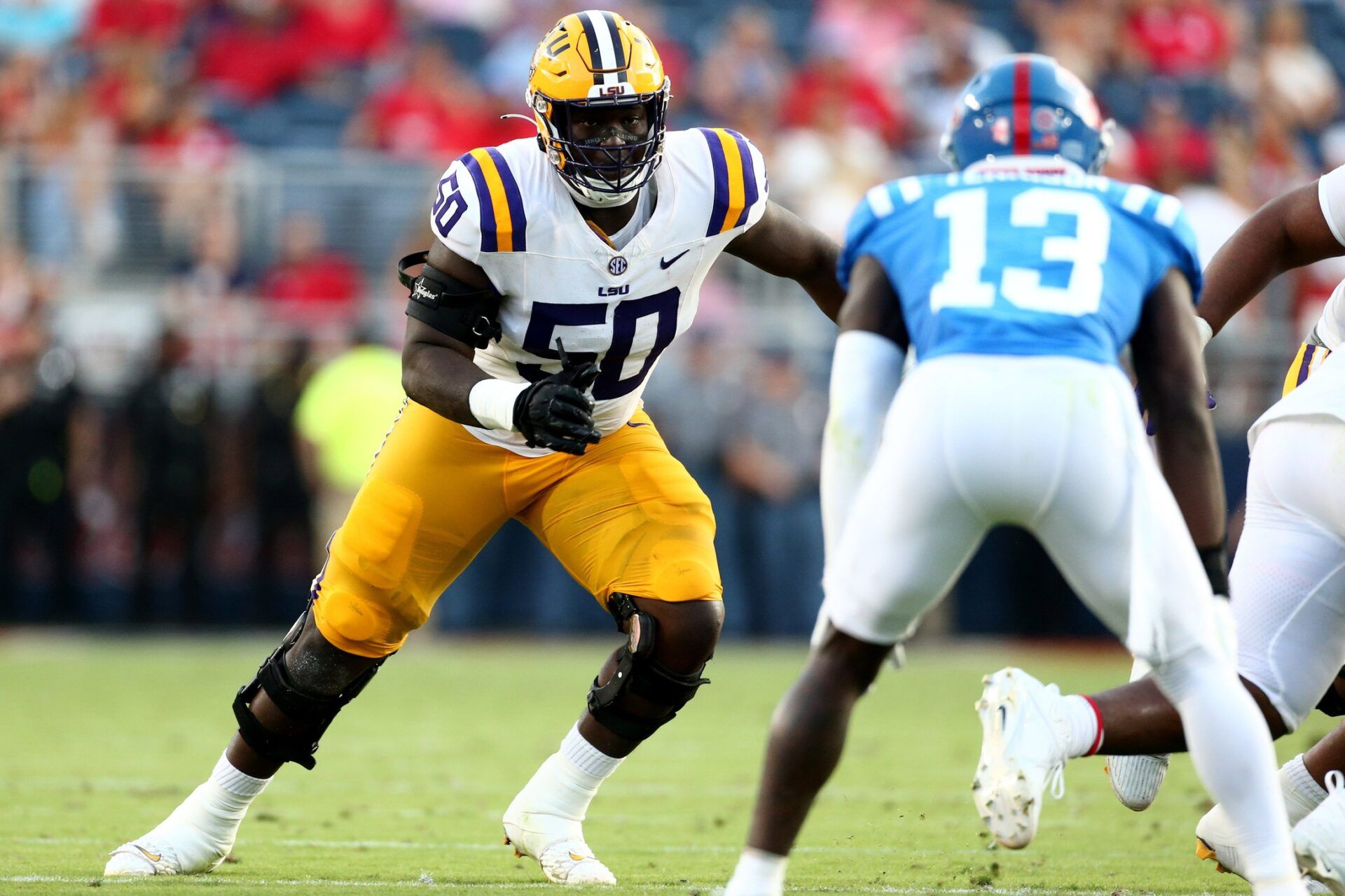 LSU Tigers offensive linemen Emery Jones Jr. (50) blocks during the first half against the Mississippi Rebels at Vaught-Hemingway Stadium. Jones lands in Tennessee in our latest Titans mock draft. Mandatory Credit: Petre Thomas-USA TODAY Sports