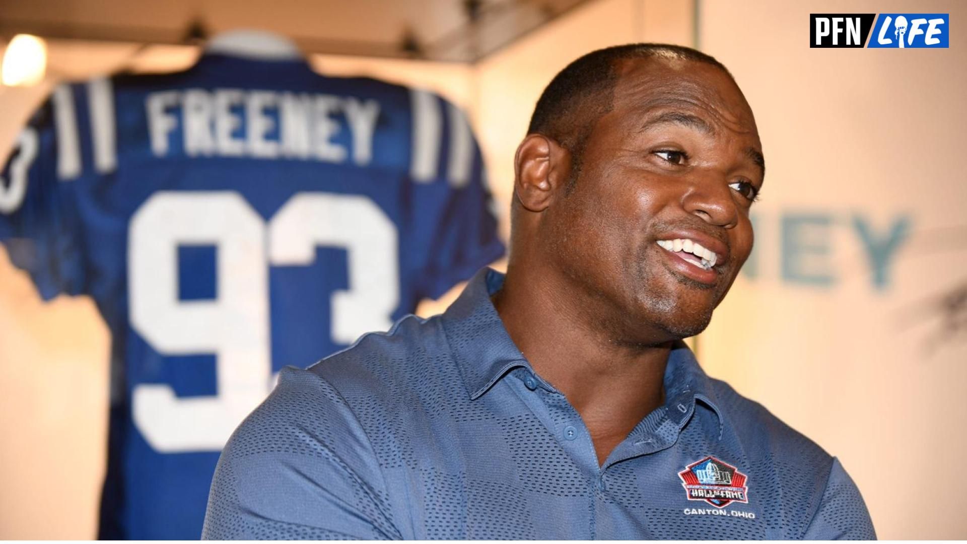 Dwight Freeney, a member of the Pro Football Hall of Fame's Class of 2024, talks with visitors during a visit to the Hall, Friday, May 24, 2024.