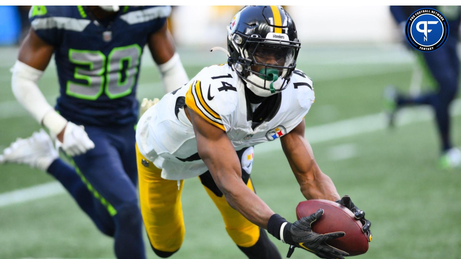 Pittsburgh Steelers wide receiver George Pickens (14) catches a pass against the Seattle Seahawks during the second half at Lumen Field. Mandatory Credit: Steven Bisig-USA TODAY Sports