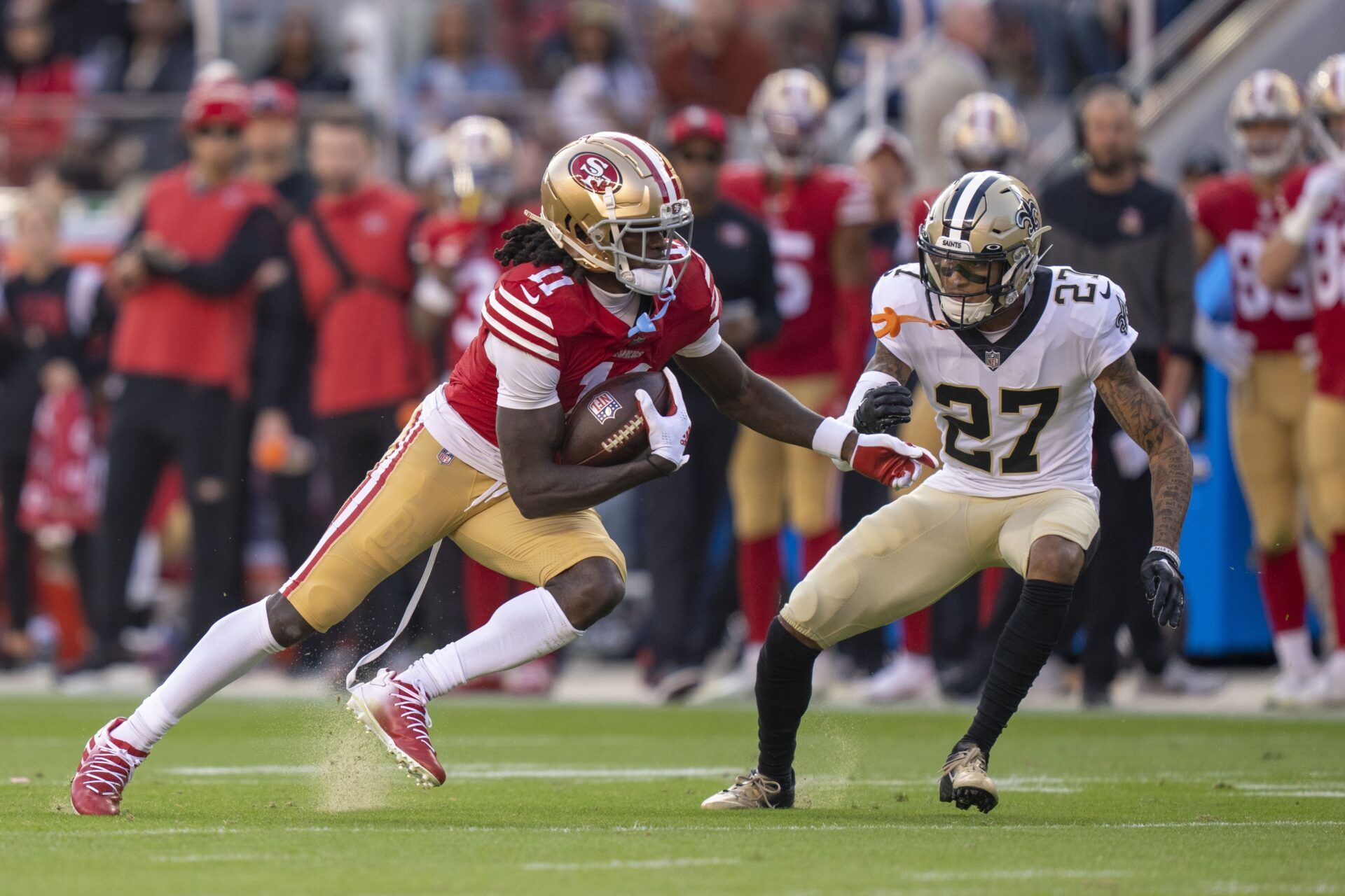 San Francisco 49ers WR Brandon Aiyuk (11) runs after the catch against the New Orleans Saints.