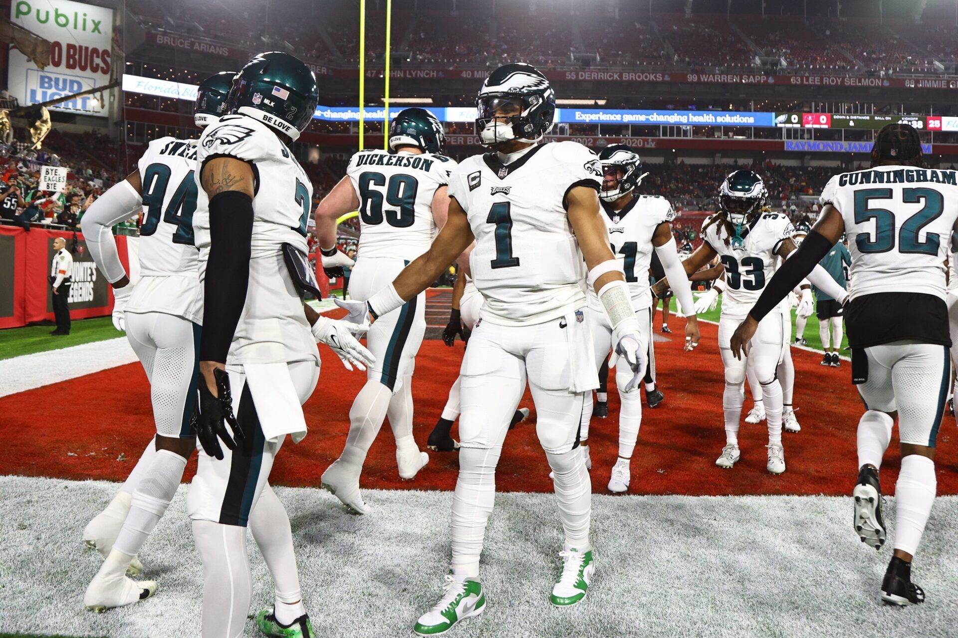 Philadelphia Eagles quarterback Jalen Hurts (1) greets teammates as they take the field for warm ups before a 2024 NFC wild card game against the Tampa Bay Buccaneers at Raymond James Stadium.