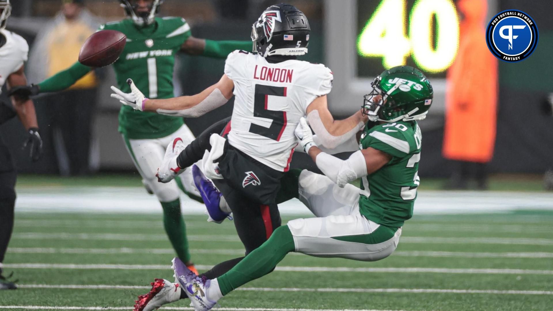 New York Jets cornerback Michael Carter II (30) breaks up a pass intended of Atlanta Falcons wide receiver Drake London (5) during the second half at MetLife Stadium.