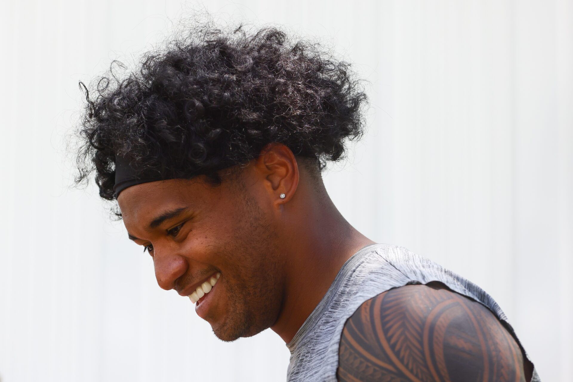 Miami Dolphins quarterback Tua Tagovailoa (1) reacts during mandatory minicamp at Baptist Health Training Complex.