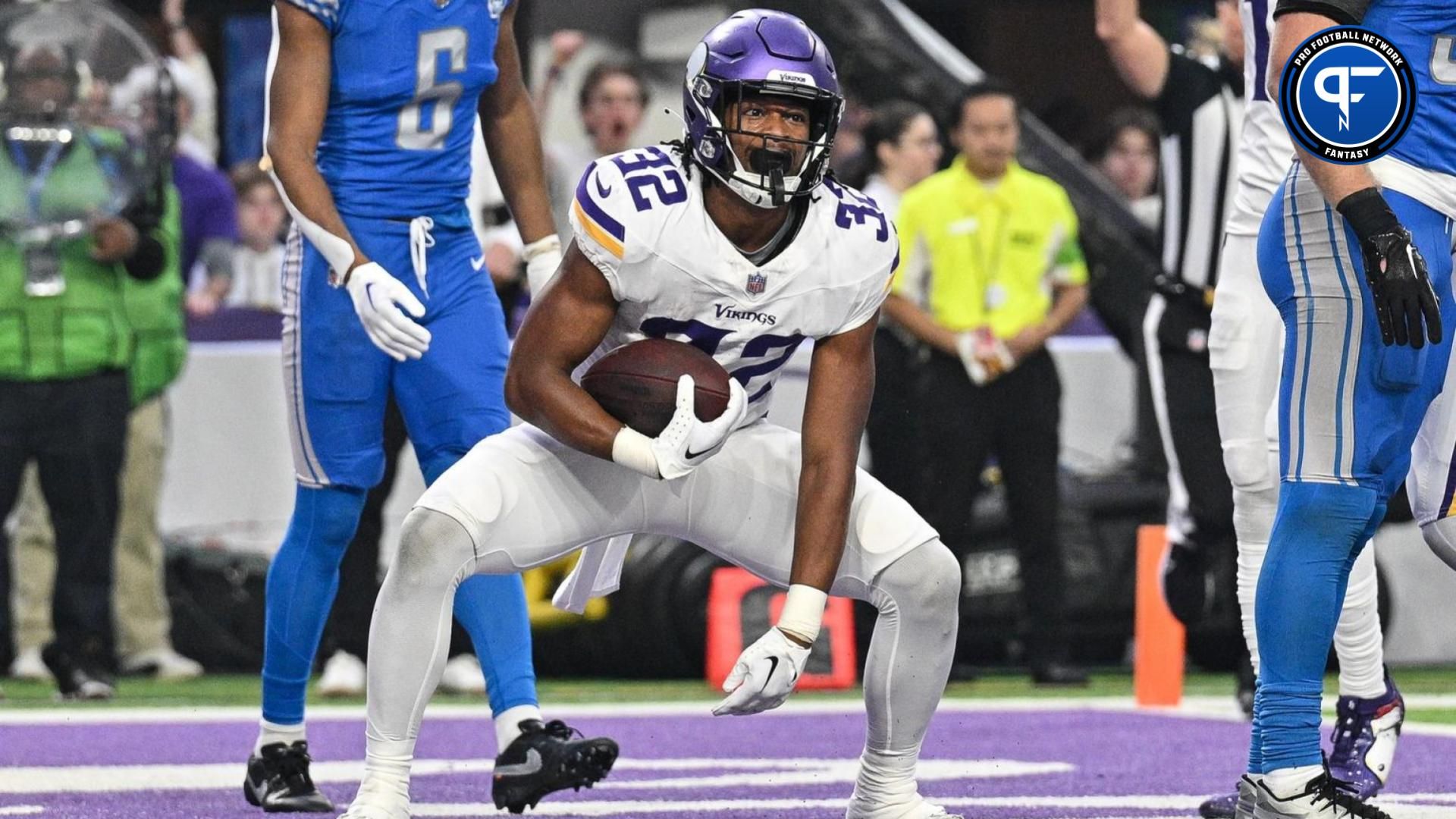 Minnesota Vikings running back Ty Chandler (32) reacts after scoring a touchdown against the Detroit Lions during the game at U.S. Bank Stadium.