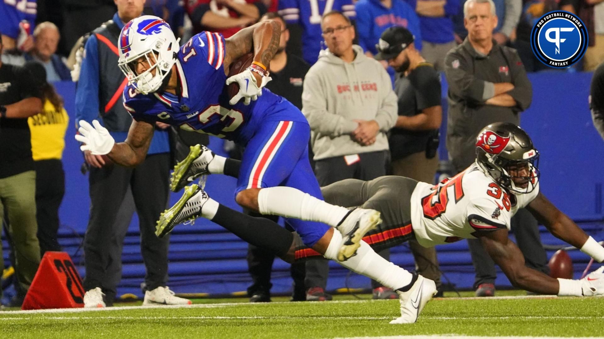 Buffalo Bills wide receiver Gabe Davis (13) runs with the ball after making a catch \against the Tampa Bay Buccaneers during the second half at Highmark Stadium.