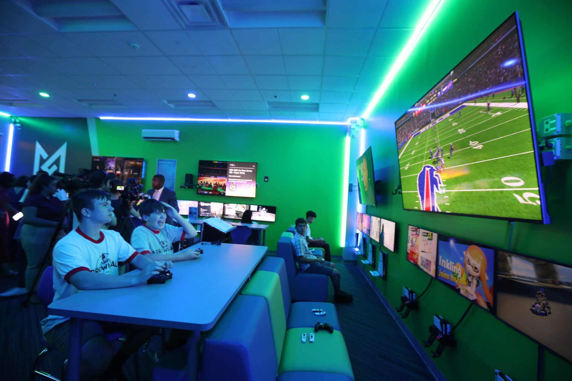 YMCA members Jackson Stevens and Liam Monahan play a game of Madden NFL 25 during the unveiling of the new gaming lab at the Maplewood Family YMCA.