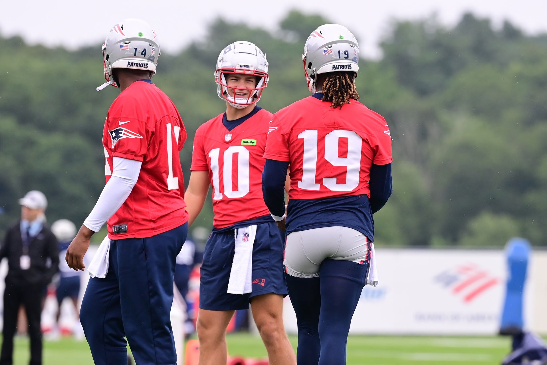 New England Patriots quarterback Drake Maye (10) waits for drills to start with quarterback Jacoby Brissett (14) and quarterback Joe Milton III (19) training camp at Gillette Stadium. Mandatory Credit: Eric Canha-USA TODAY Sports