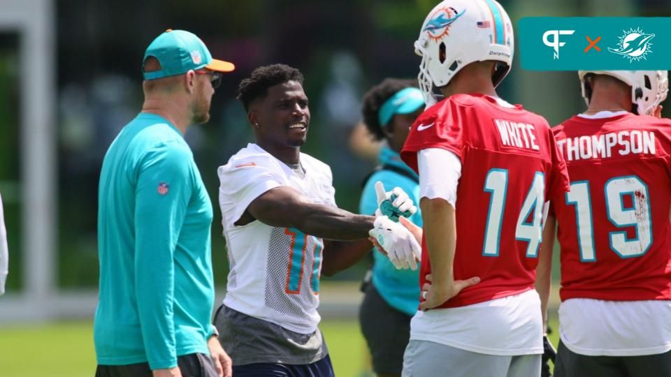 Miami Dolphins wide receiver Tyreek Hill (10) shakes hands with quarterback Mike White (14) during mandatory minicamp at Baptist Health Training Complex.