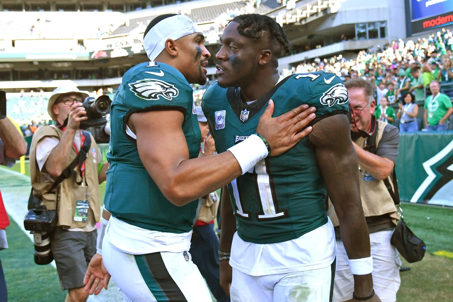 Philadelphia Eagles quarterback Jalen Hurts (1) and wide receiver A.J. Brown (11) celebrate win against the Washington Commanders at Lincoln Financial Field. Mandatory Credit: Eric Hartline-USA TODAY Sports