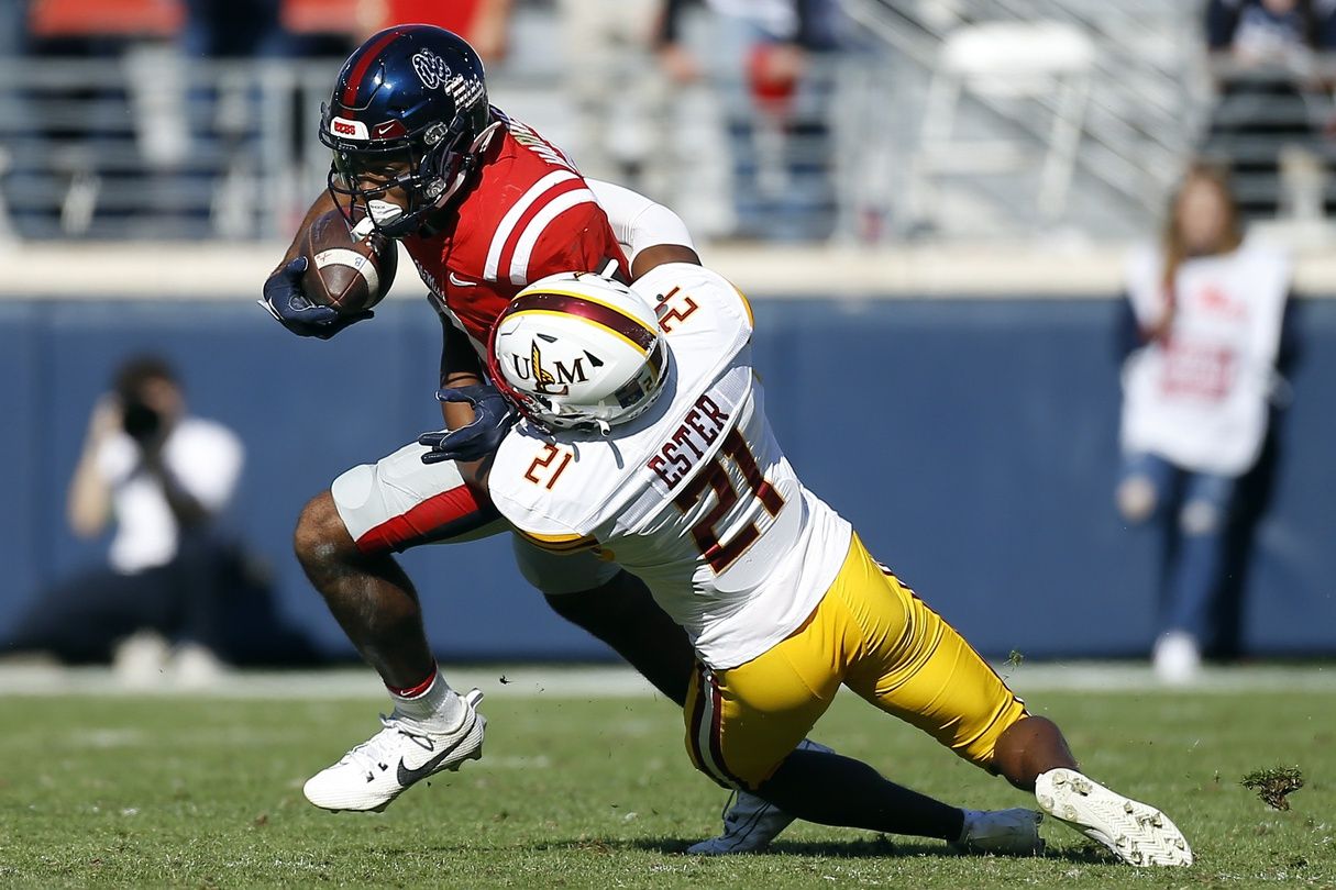 Mississippi Rebels wide receiver Tre Harris (9) runs after a catch as Louisiana Monroe Warhawks defensive back Jyren Ester (21) makes the tackle during the second half at Vaught-Hemingway Stadium.