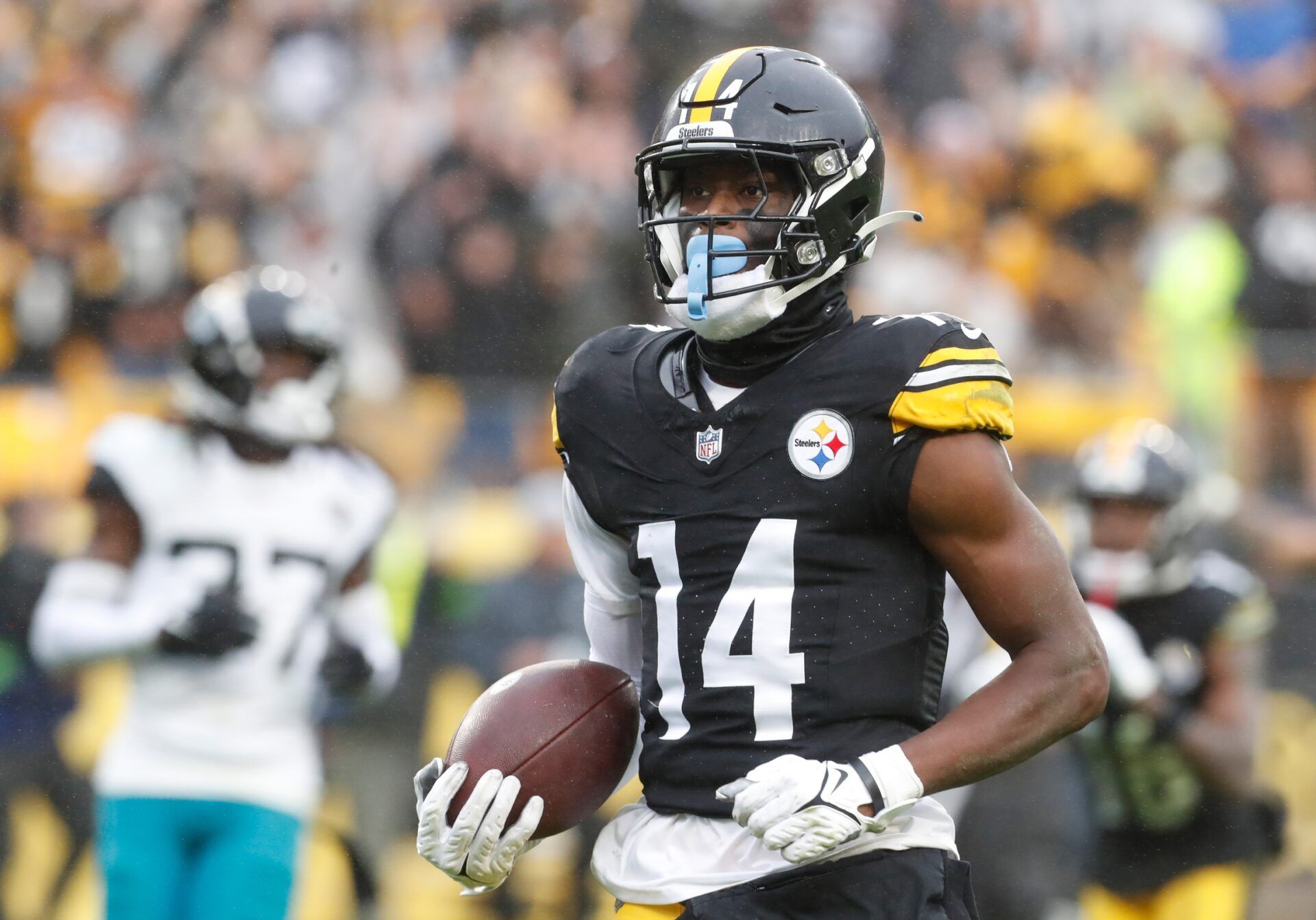 Pittsburgh Steelers wide receiver George Pickens (14) runs to score a touchdown on a pass reception against the Jacksonville Jaguars during the third quarter of an NFL game at Acrisure Stadium. Mandatory Credit: Charles LeClaire-USA TODAY Sports