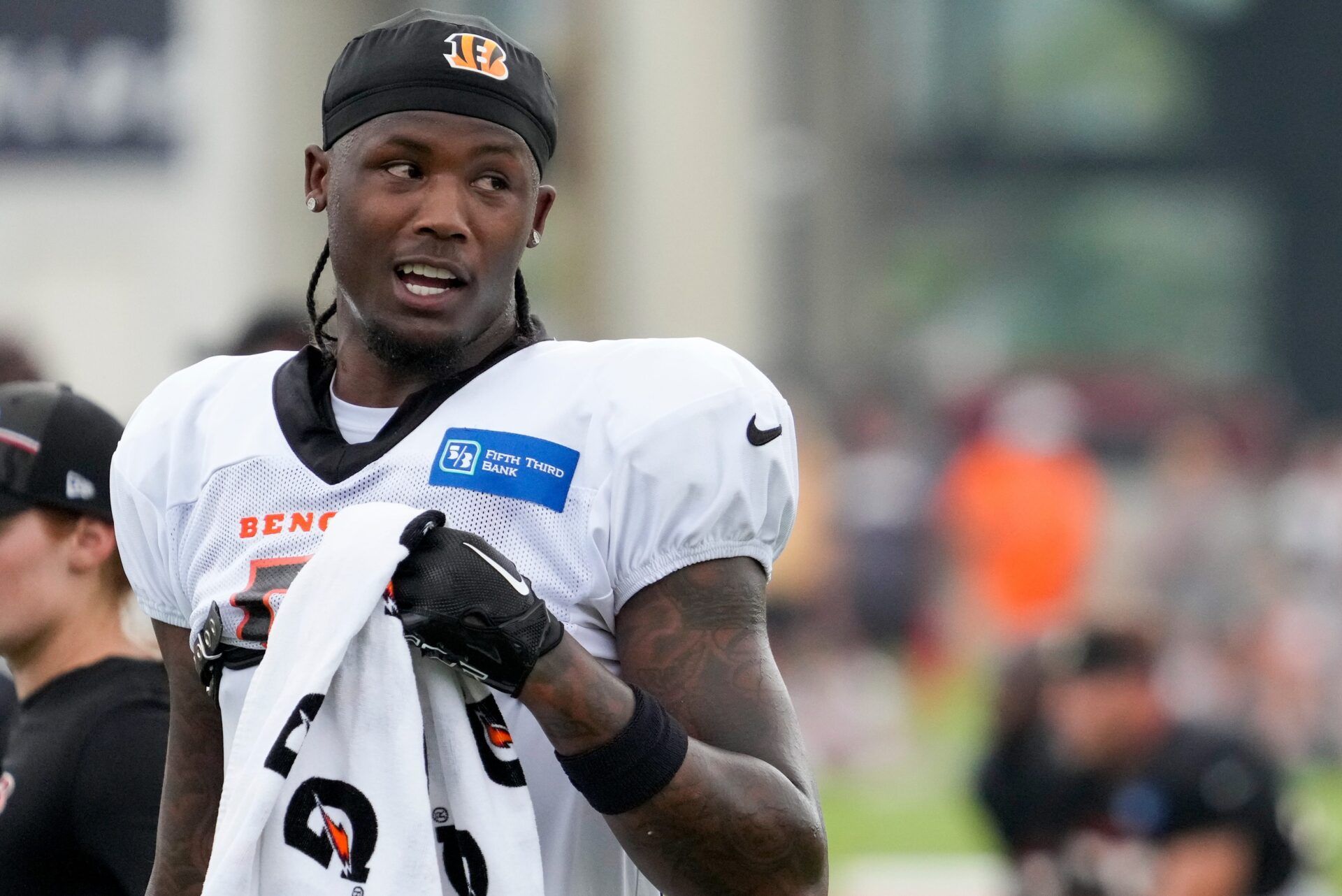 Cincinnati Bengals wide receiver Tee Higgins (5) wipes his face between reps during a preseason training camp practice at the Paycor Stadium training facility in downtown Cincinnati on Wednesday, Aug. 16, 2023. Higgins is one of many NFL players who could use a change of scenery.