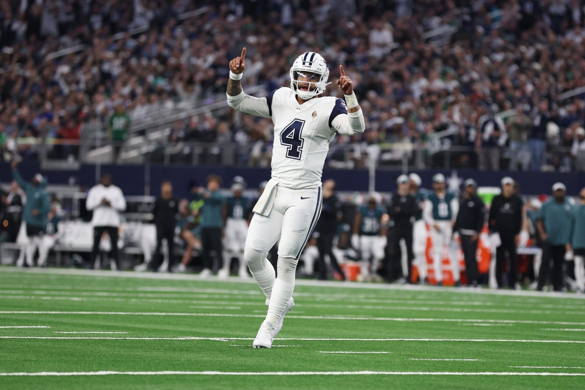 Dallas Cowboys quarterback Dak Prescott (4) celebrates a touchdown in the second quarter against the Philadelphia Eagles at AT&T Stadium. Mandatory Credit: Tim Heitman-USA TODAY Sports