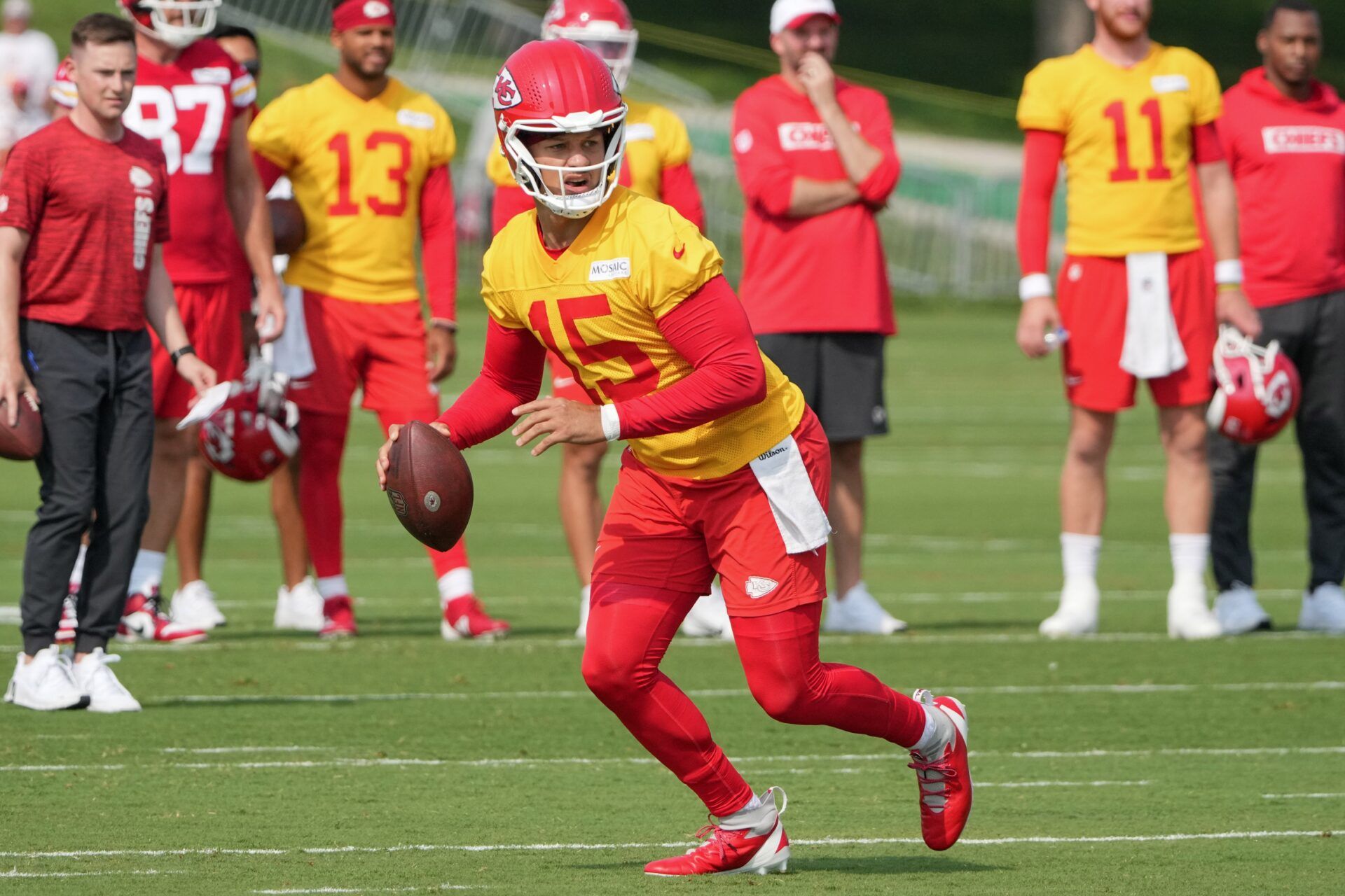 Kansas City Chiefs QB Patrick Mahomes (15) looks to throw during training camp.