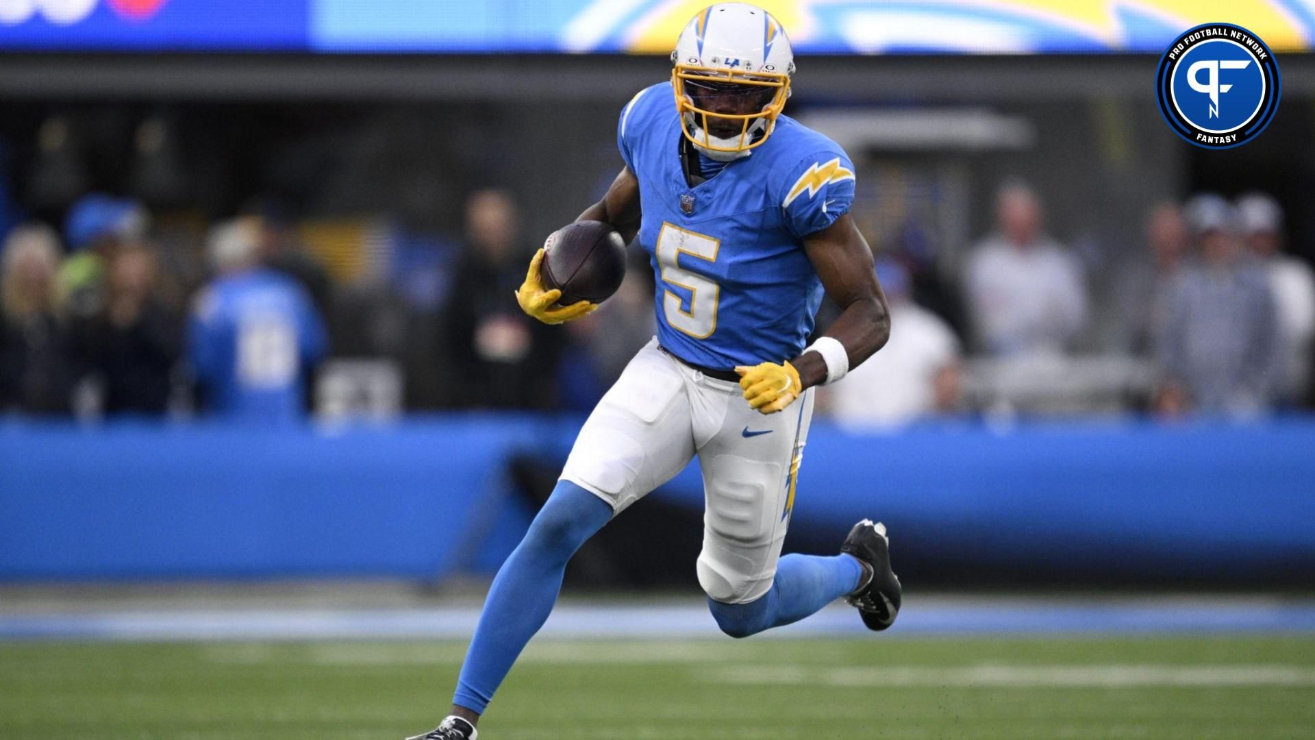 Los Angeles Chargers wide receiver Joshua Palmer (5) runs with the ball during the second half against the Kansas City Chiefs at SoFi Stadium.