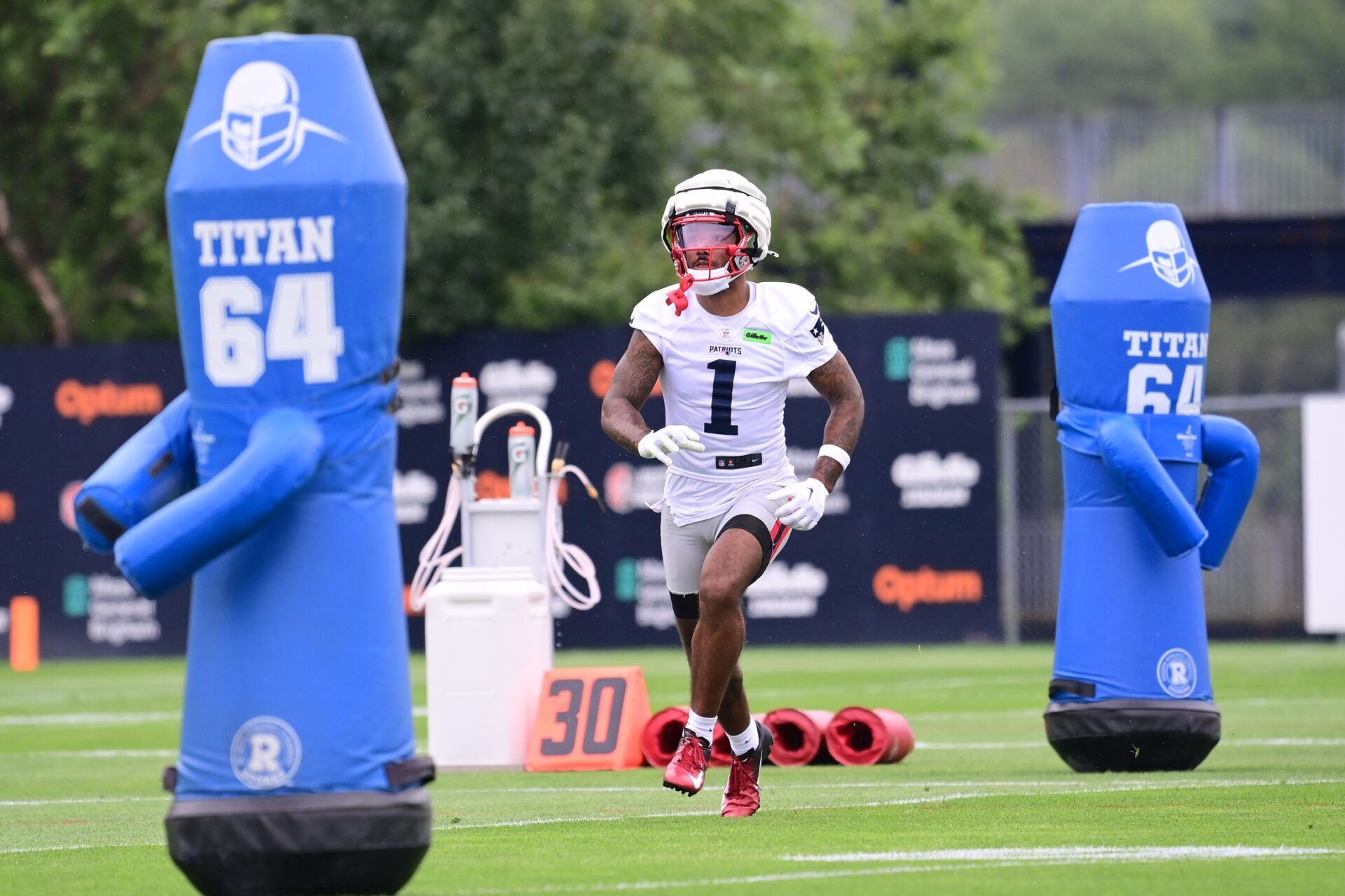 New England Patriots wide receiver Ja'Lynn Polk (1) tracks the ball during training camp at Gillette Stadium.