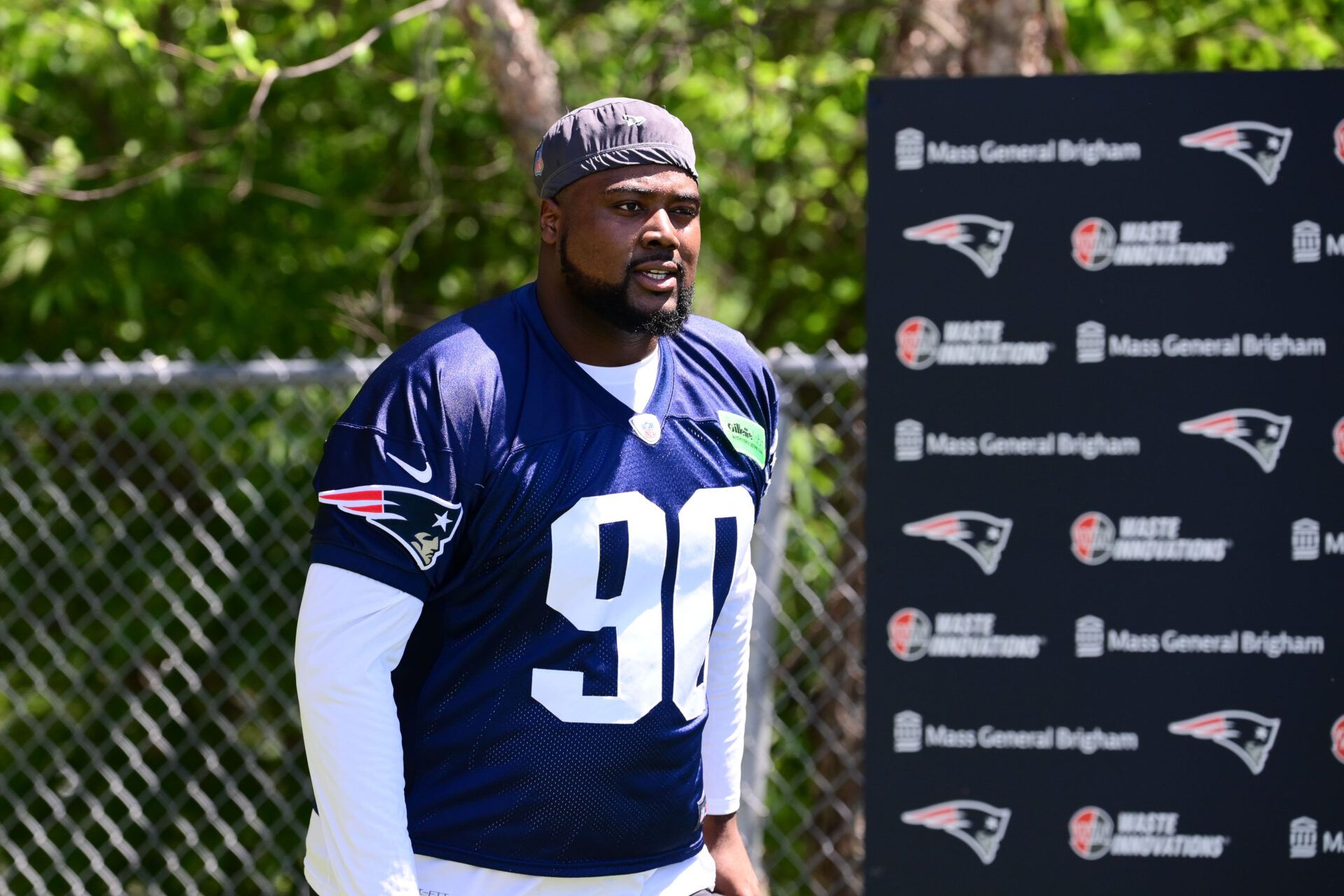 Jun 10, 2024; Foxborough, MA, USA; New England Patriots defensive tackle Christian Barmore (90) walks to the practice fields for minicamp at Gillette Stadium. Mandatory Credit: Eric Canha-USA TODAY Sports