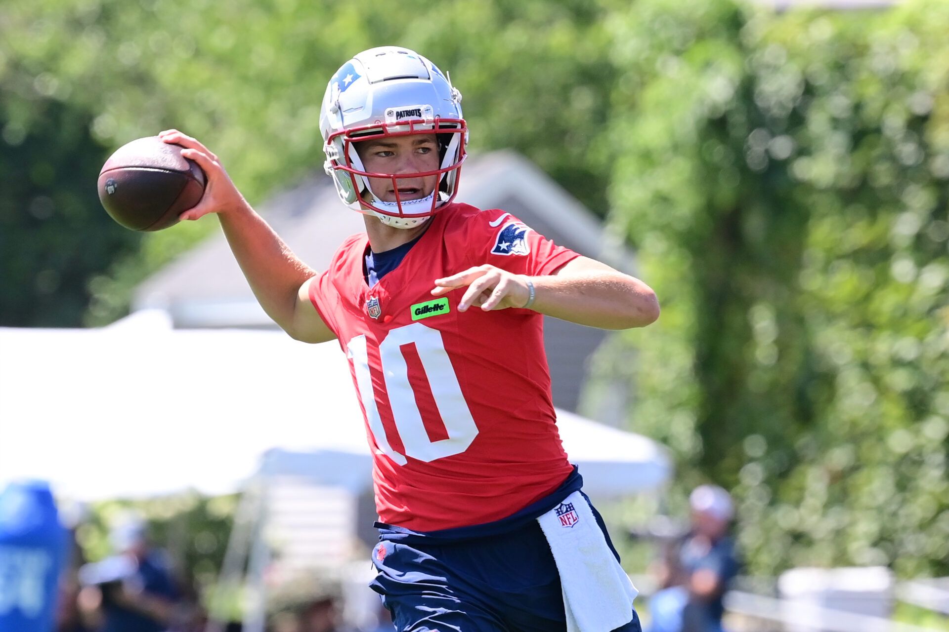 Jul 26, 2024; Foxborough, MA, USA; New England Patriots quarterback Drake Maye (10) throws a pass during training camp at Gillette Stadium. Mandatory Credit: Eric Canha-USA TODAY Sports