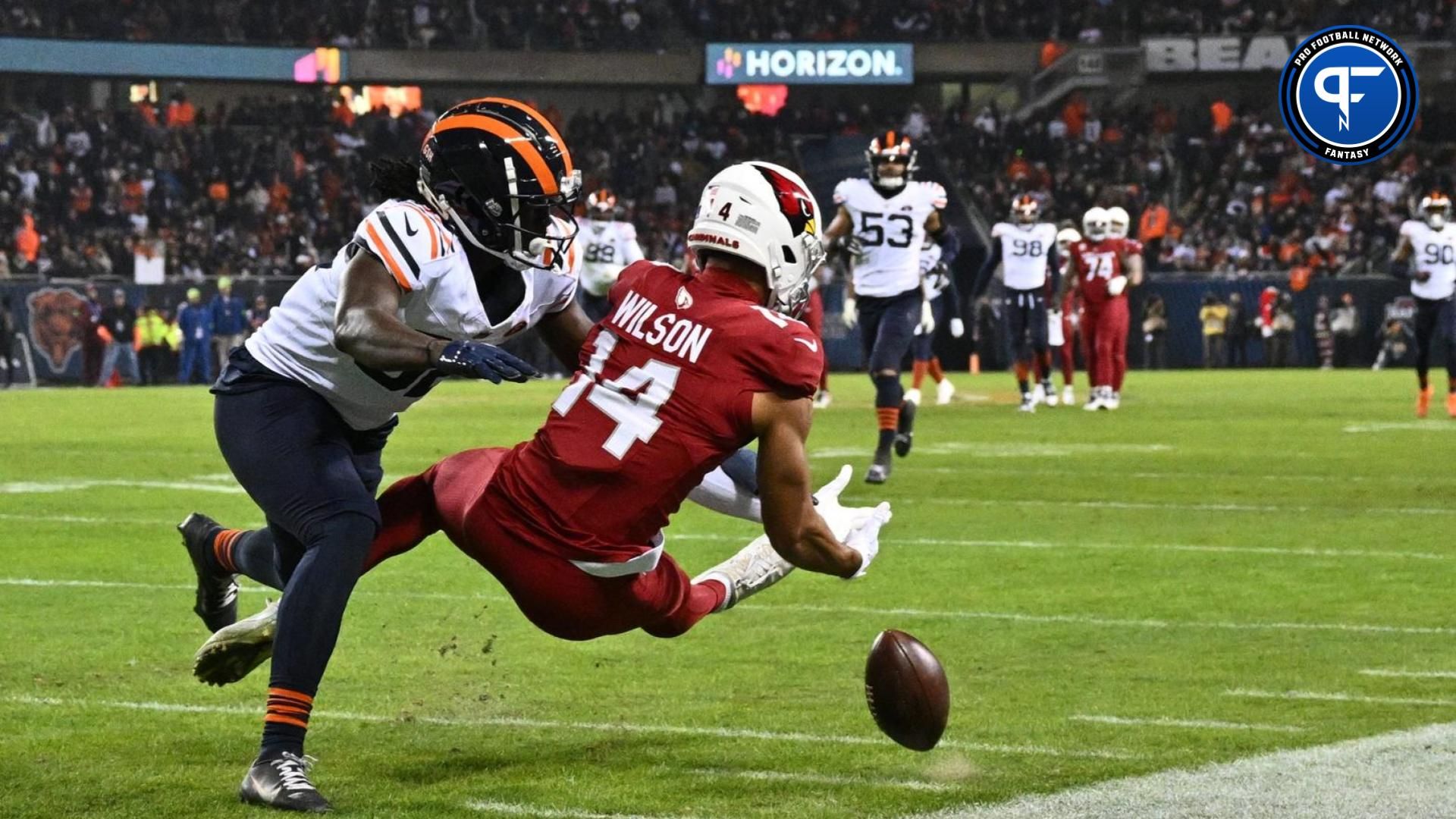 Arizona Cardinals wide receiver Michael Wilson (14) drops a pass while being defended by Chicago Bears defensive back Terell Smith (32) in the second half at Soldier Field.