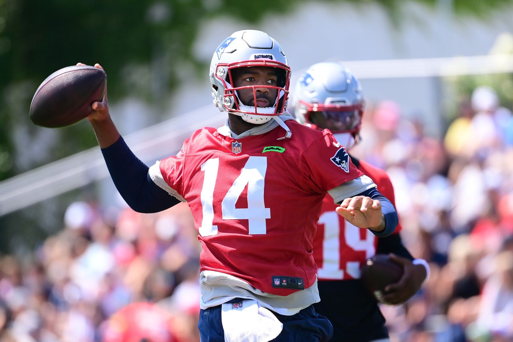 New England Patriots QB Jacoby Brissett (14) throws a pass during training camp at Gillette Stadium.