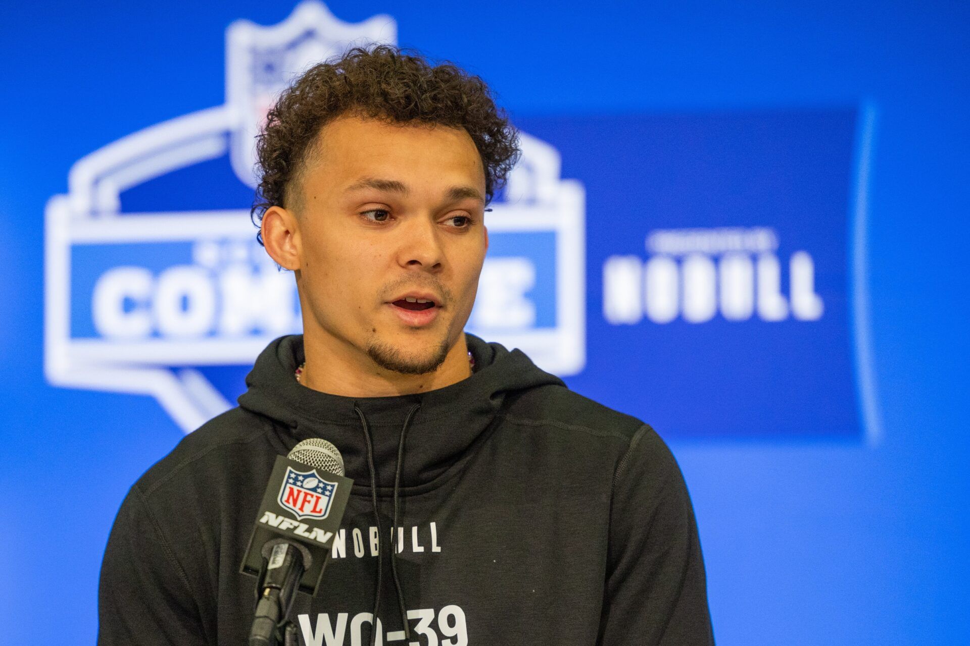 Wide receiver Roman Wilson talks to the media at the 2024 NFL Combine.