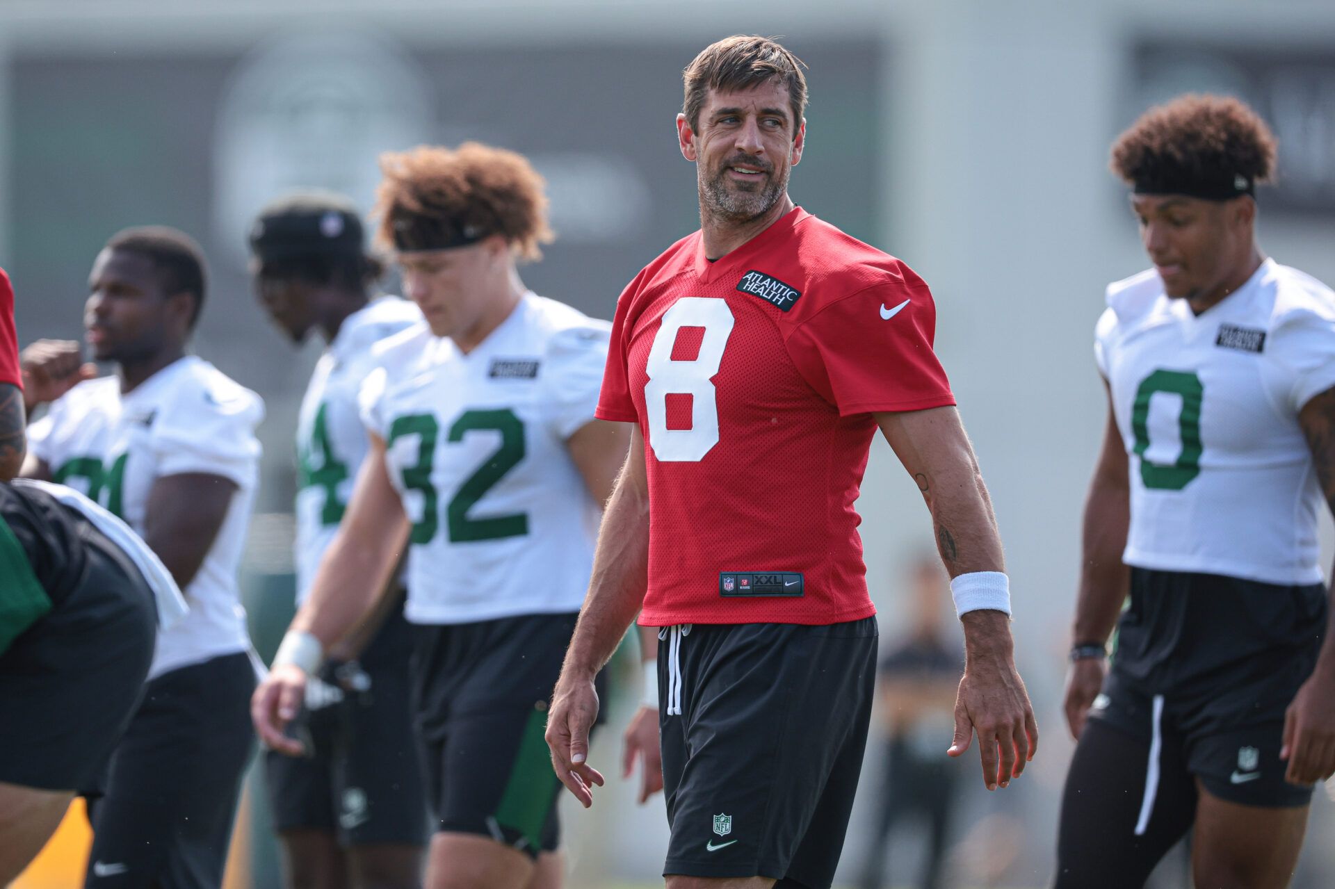 Jul 27, 2024; Florham Park, NJ, USA; New York Jets quarterback Aaron Rodgers (8) looks back during training camp at Atlantic Health Jets Training Center. Mandatory Credit: Vincent Carchietta-USA TODAY Sports