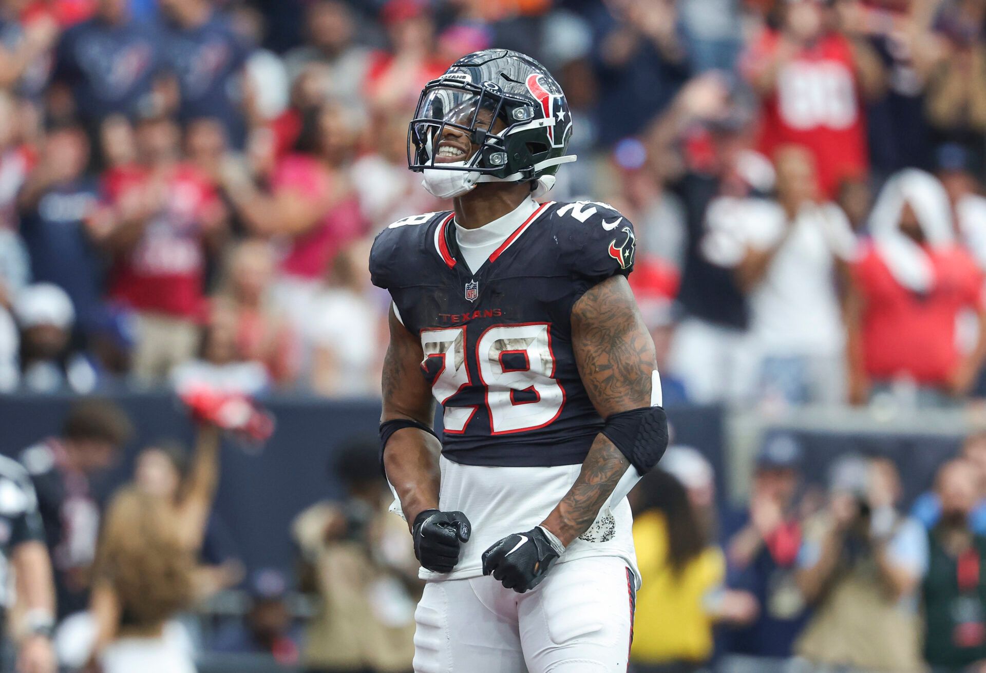 Oct 27, 2024; Houston, Texas, USA; Houston Texans running back Joe Mixon (28) reacts after a play during the fourth quarter against the Indianapolis Colts at NRG Stadium. Mandatory Credit: Troy Taormina-Imagn Images