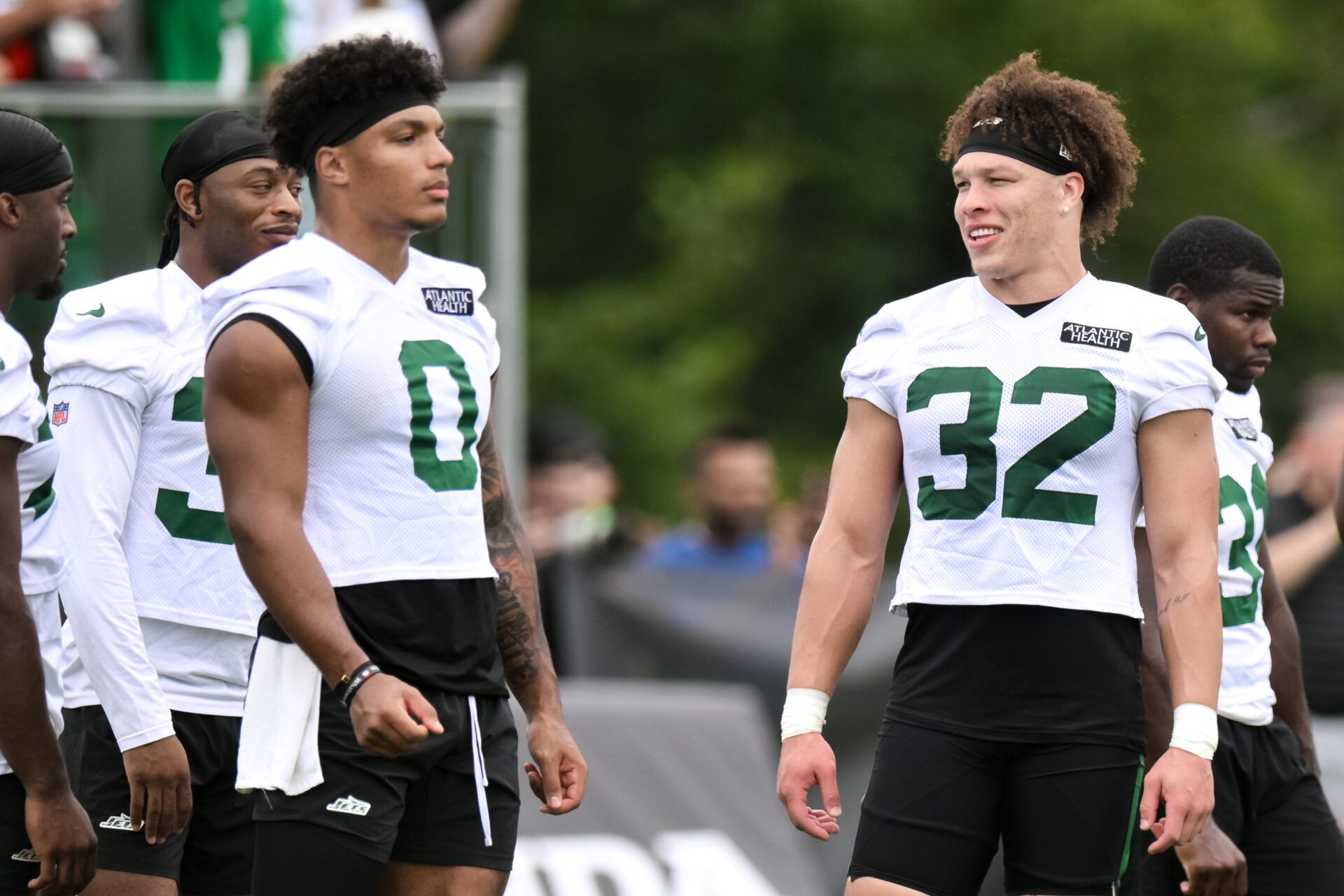 Jul 25, 2024; Florham Park, NJ, USA; New York Jets running back Isaiah Davis (32) chats with running back Braelon Allen (0) during training camp at Atlantic Health Jets Training Center. Mandatory Credit: John Jones-USA TODAY Sports