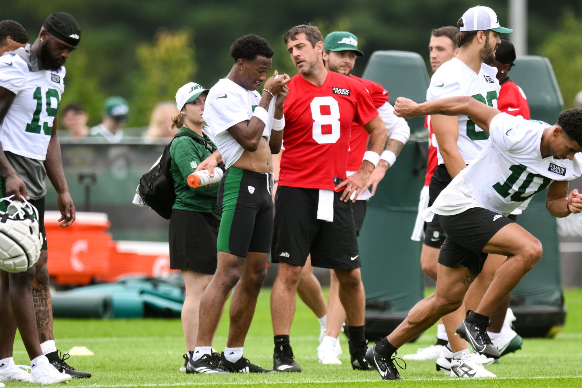 Jul 25, 2024; Florham Park, NJ, USA; New York Jets quarterback Aaron Rodgers (8) talks with wide receiver Garrett Wilson (5) during training camp at Atlantic Health Jets Training Center. Mandatory Credit: John Jones-USA TODAY Sports