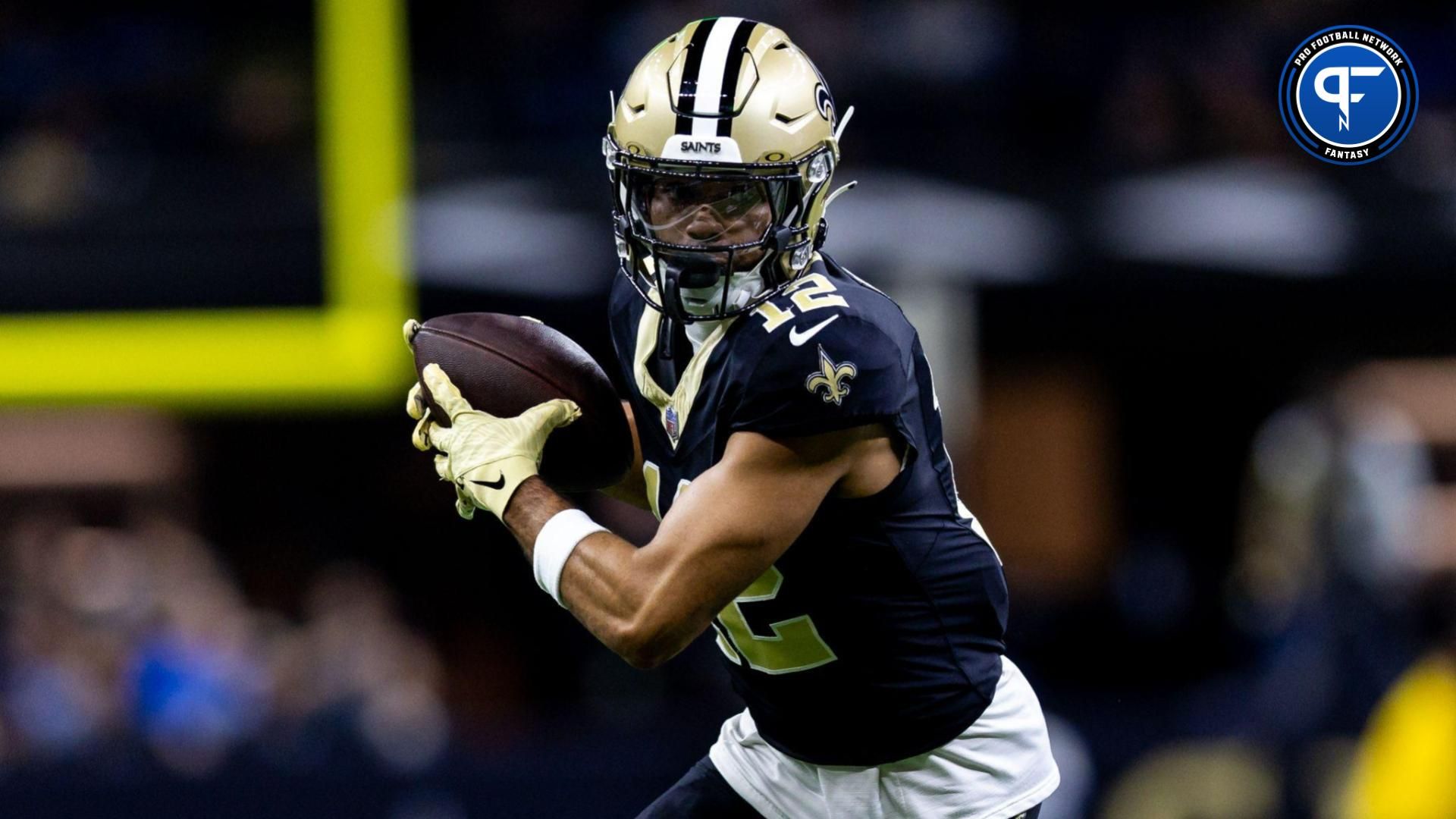 Dec 3, 2023; New Orleans, Louisiana, USA; New Orleans Saints wide receiver Chris Olave (12) catches a pass against the Detroit Lions during the first half at the Caesars Superdome. Mandatory Credit: Stephen Lew-USA TODAY Sports