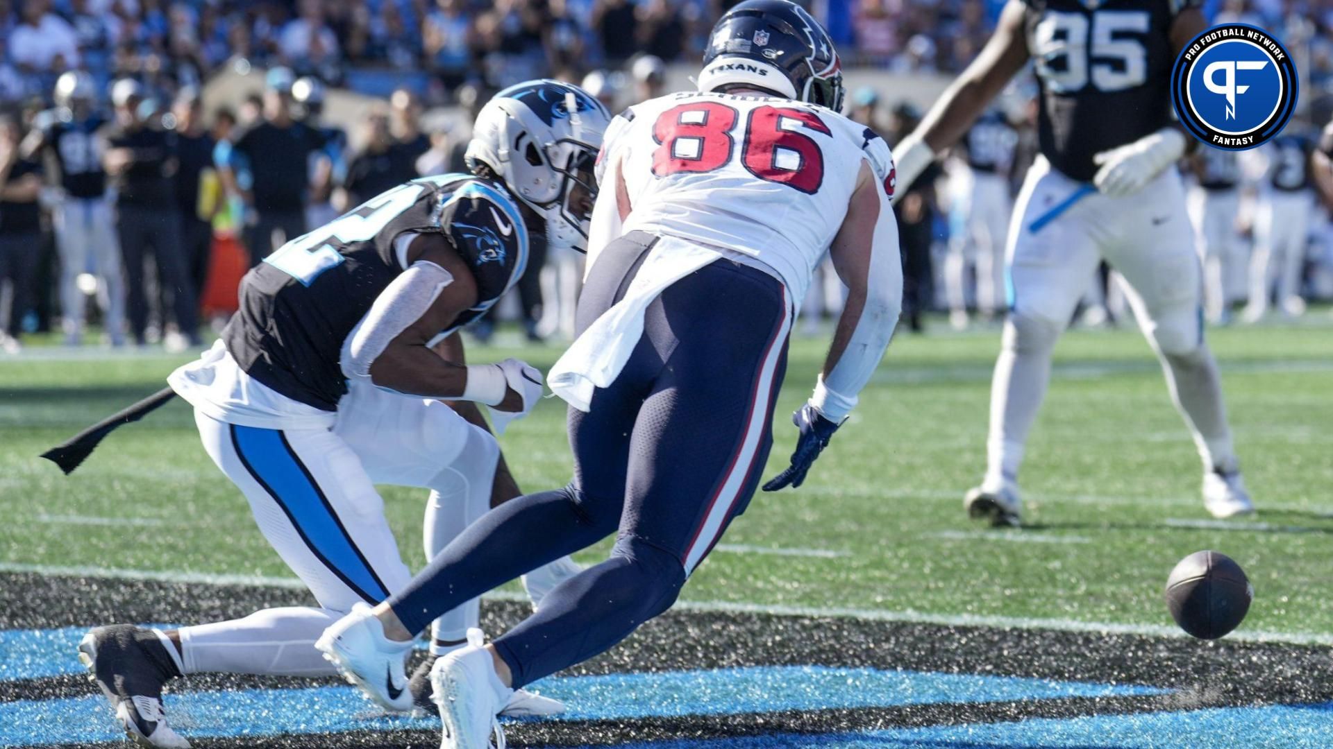 A pass to Houston Texans tight end Dalton Schultz (86) is broken up by Carolina Panthers safety Jammie Robinson (22) during the second half at Bank of America Stadium.