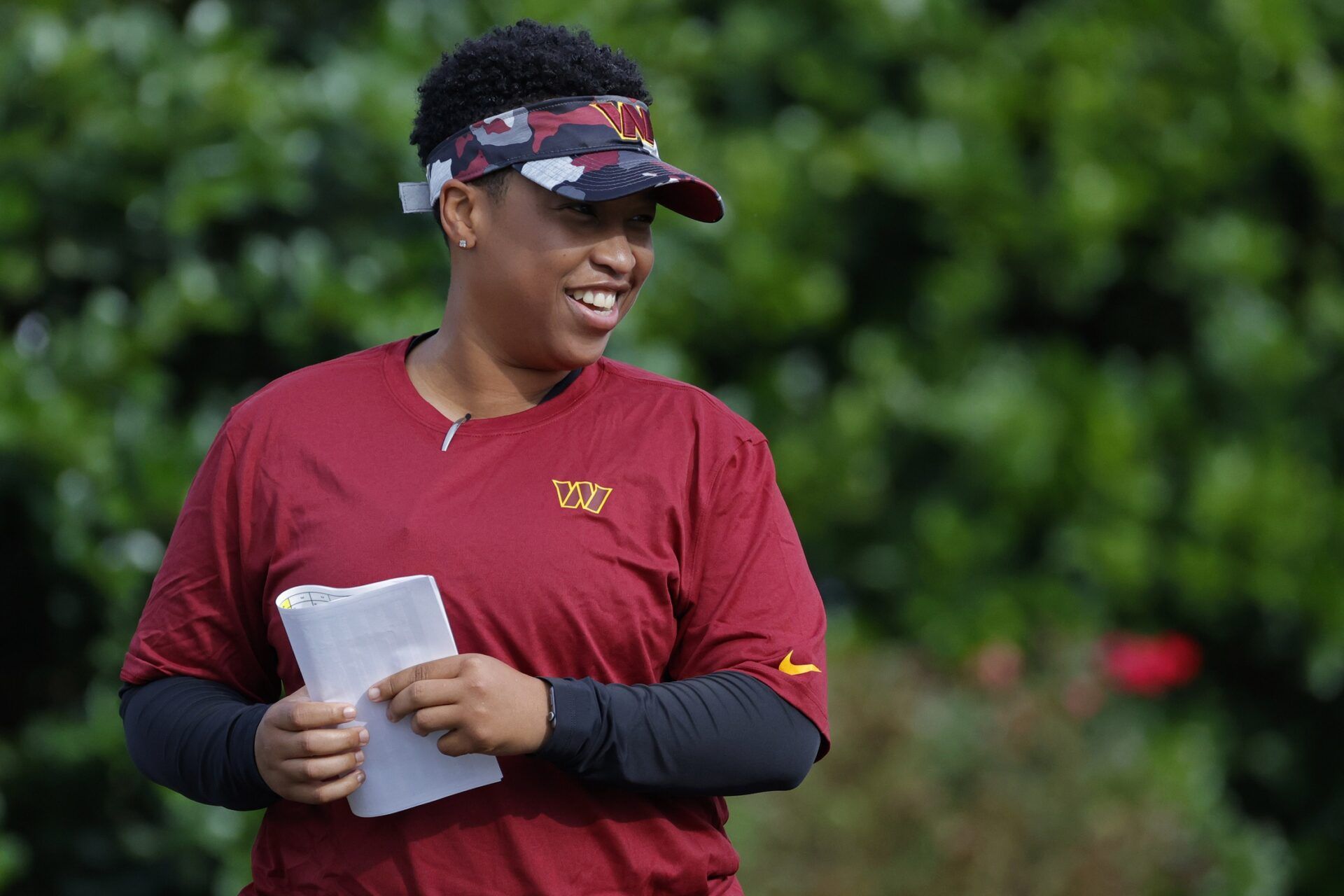 Former Washington Commanders and current Chicago Bears coach, Jennifer King, looks on during training camp.