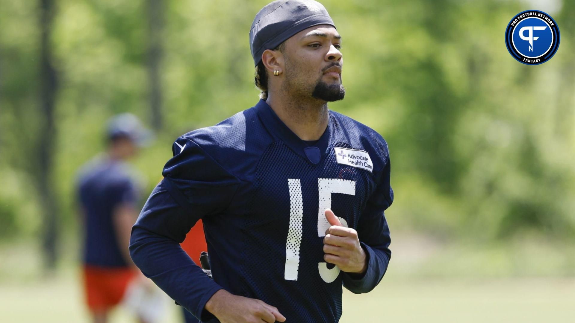 Chicago Bears wide receiver Rome Odunze (15) warms up during organized team activities at Halas Hall.