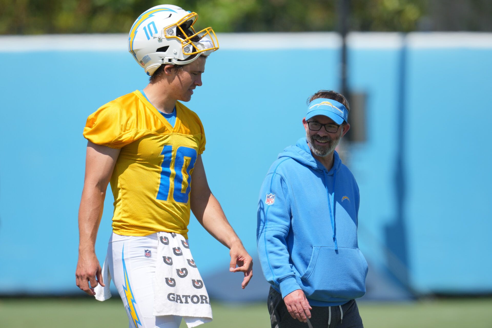 Jun 13, 2024; Costa Mesa, CA, USA; Los Angeles Chargers quarterback Justin Herbert (10) interacts with quarterbacks coach Shane Day during minicamp at the Hoag Performance Center. Mandatory Credit: Kirby Lee-USA TODAY Sports