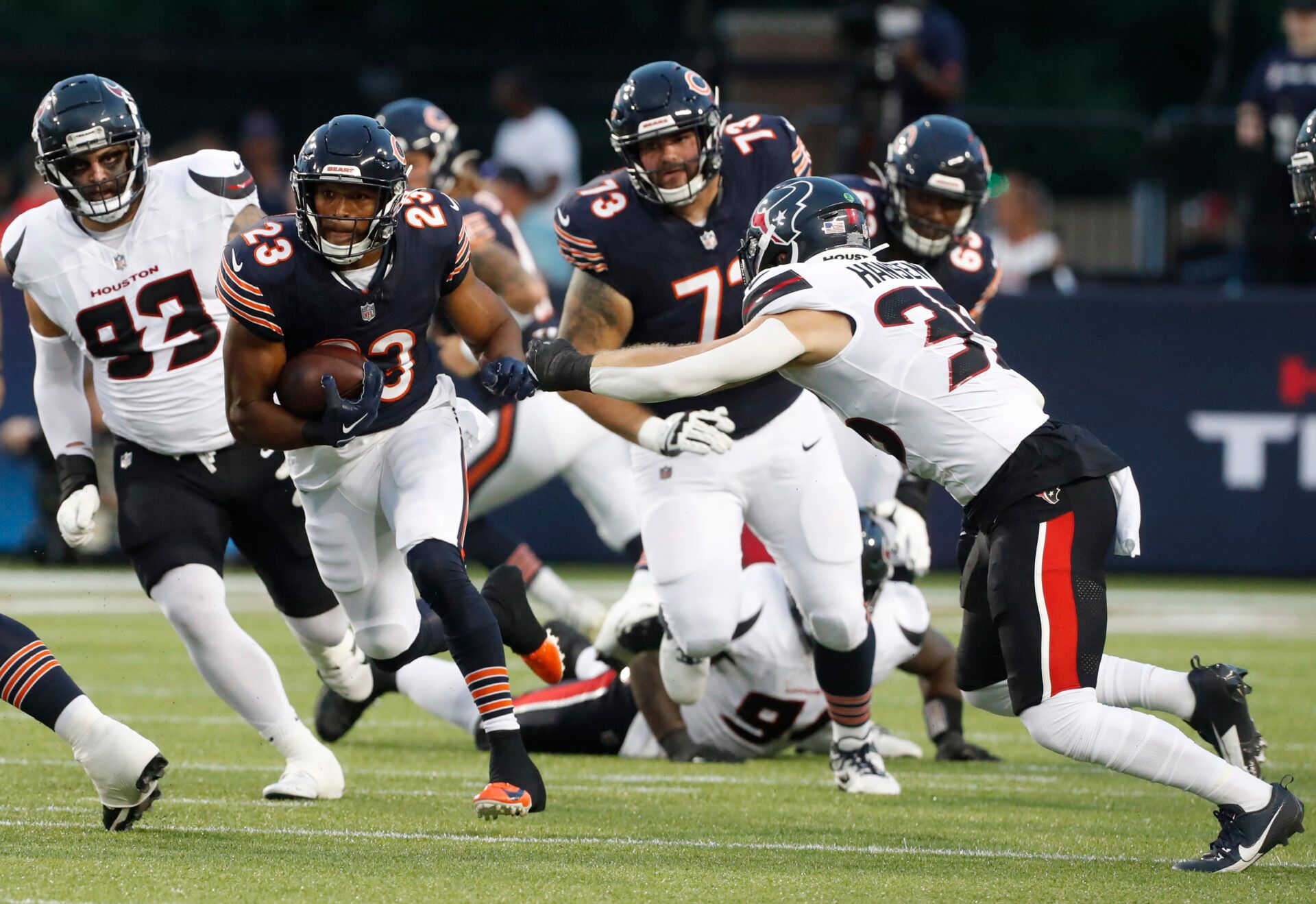 Aug 1, 2024; Canton, Ohio, USA; Chicago Bears running back Roschon Johnson (23) rushes the ball against he Houston Texans during the first quarter at Tom Benson Hall of Fame Stadium. Mandatory Credit: Charles LeClaire-USA TODAY Sports