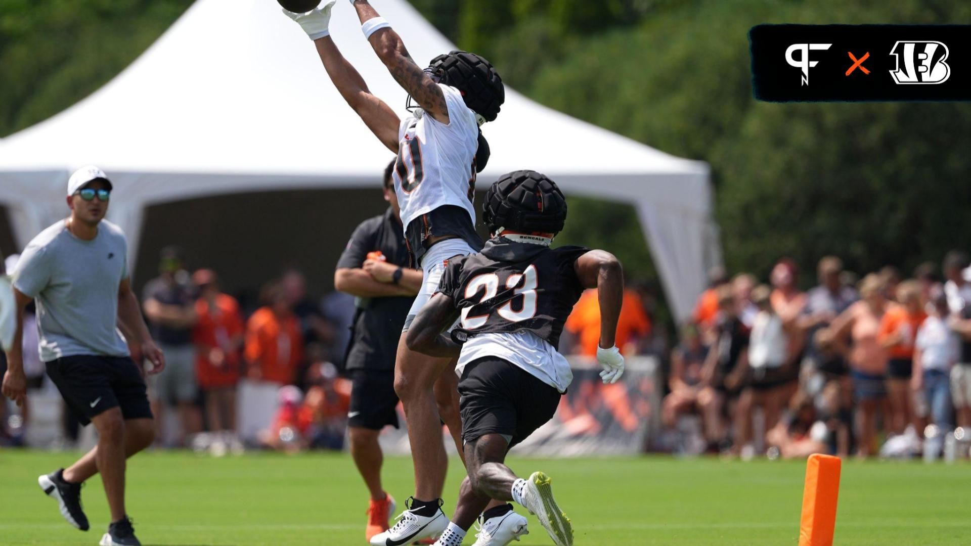 Cincinnati Bengals wide receiver Andrei Iosivas (80) catches a pass against safety Dax Hill (23) during training camp practice.