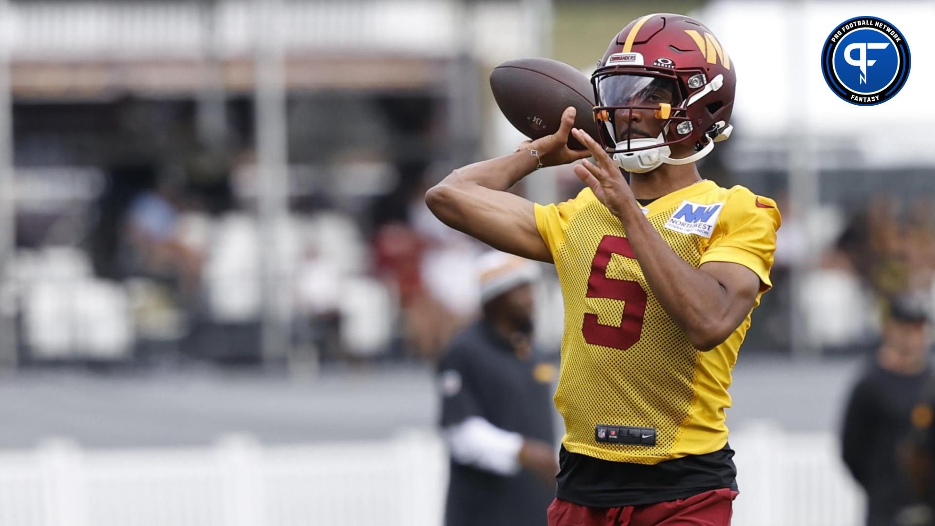 Jul 26, 2024; Ashburn, VA, USA; Washington Commanders quarterback Jayden Daniels (5) passes the ball on day three of training camp at Commanders Park. Mandatory Credit: Geoff Burke-USA TODAY Sports