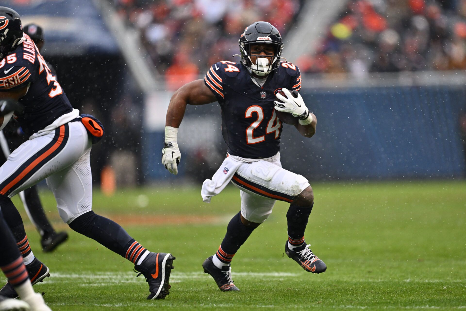 Dec 31, 2023; Chicago, Illinois, USA; Chicago Bears running back Khalil Herbert (24) gets outside to pick up a first down in the first half against the Atlanta Falcons at Soldier Field. Mandatory Credit: Jamie Sabau-USA TODAY Sports