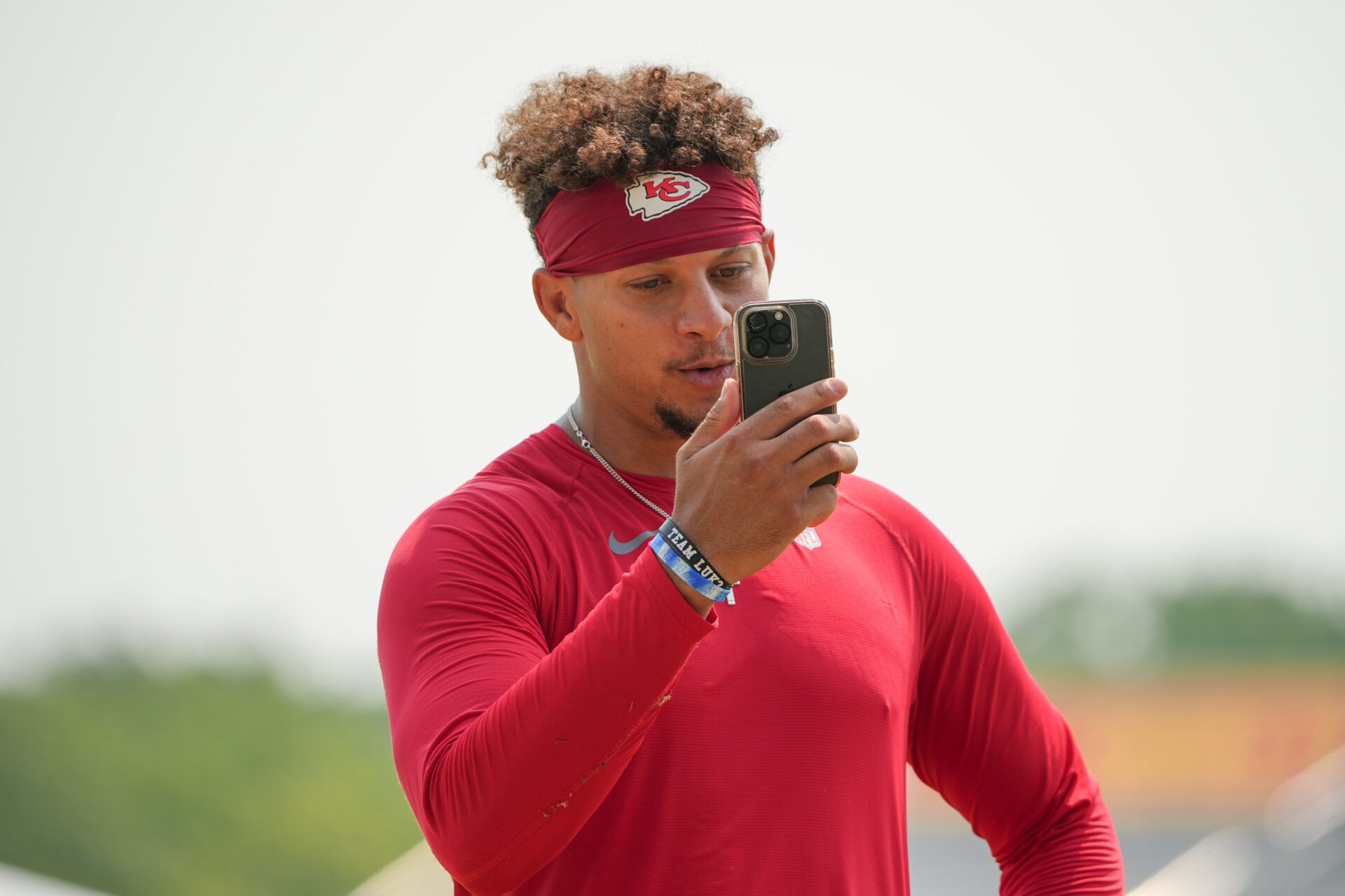 Jul 26, 2024; Kansas City, MO, USA; Kansas City Chiefs quarterback Patrick Mahomes (15) records a video message after training camp at Missouri Western State University. Mandatory Credit: Denny Medley-USA TODAY Sports