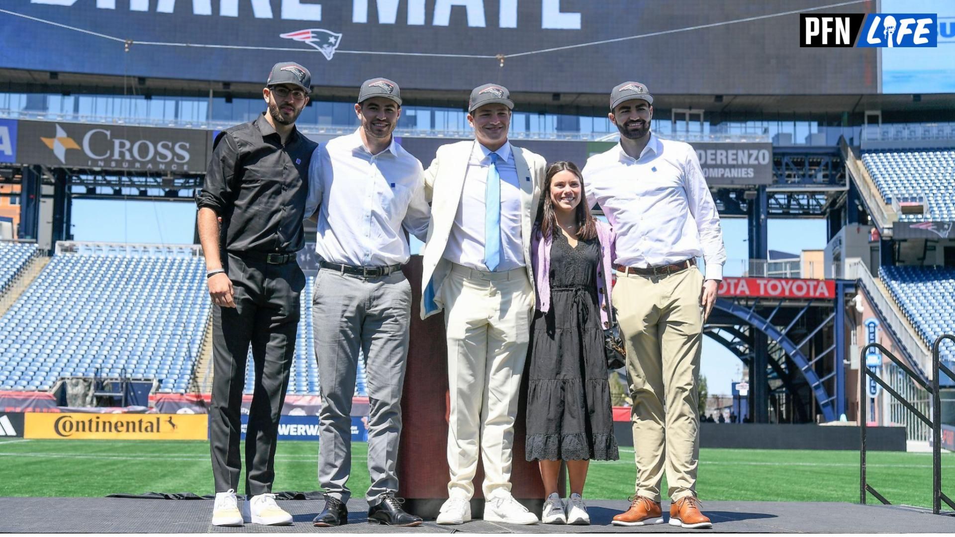 Apr 26, 2024; Foxborough, MA, USA; New England Patriots number one draft pick quarterback Drake Maye (C) introduces (L-R: Beau, Cole, Luke) and his girlfriend since 7th grade (Ann Michael) on the game field at Gillette Stadium. Mandatory Credit: Eric Canha-USA TODAY Sports