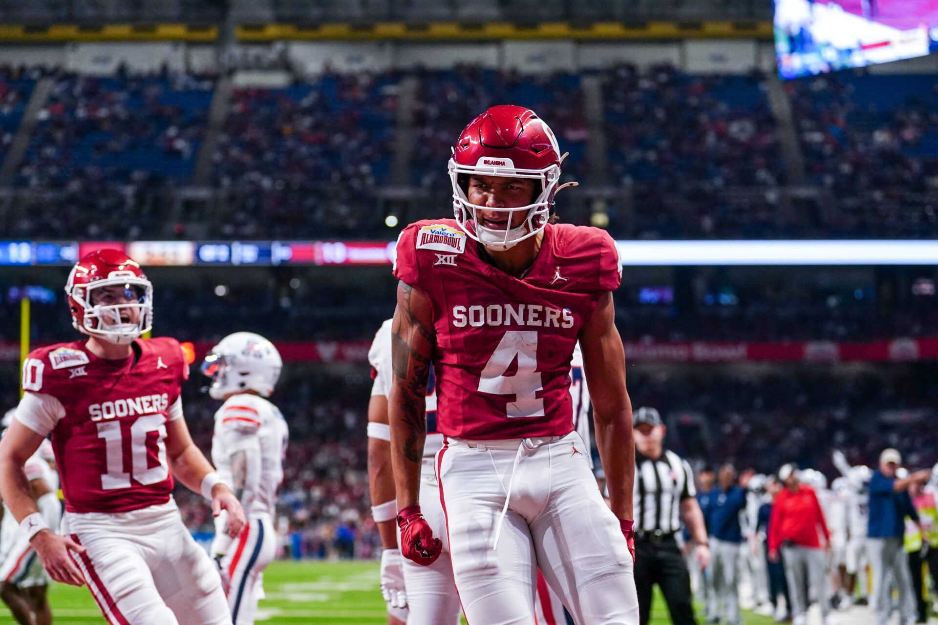 Dec 28, 2023; San Antonio, TX, USA; Oklahoma Sooners wide receiver Nic Anderson (4) celebrates a touchdown catch in the first half against the Arizona Wildcats at Alamodome. Mandatory Credit: Daniel Dunn-USA TODAY Sports