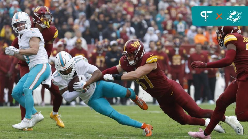 Miami Dolphins wide receiver Jaylen Waddle (17) is tackled vy Washington Commanders linebacker Cody Barton (57) during the second quarter at FedExField.