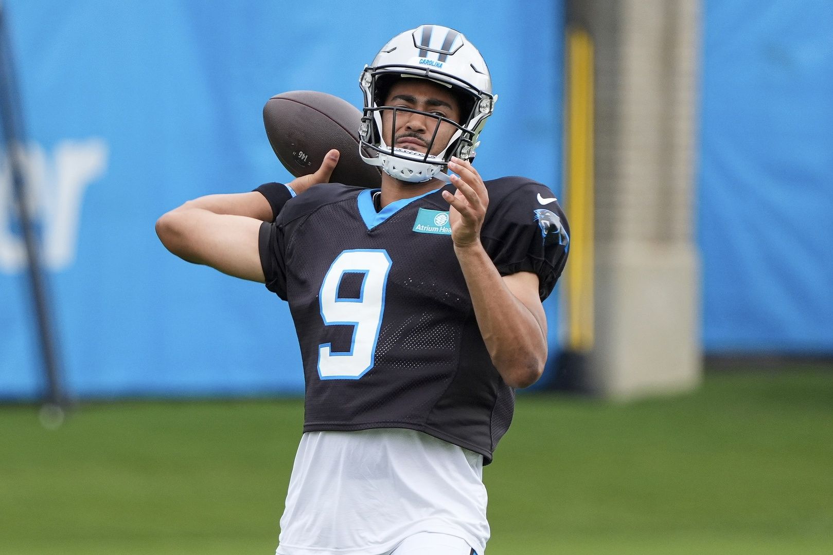 Carolina Panthers QB Bryce Young throws a pass during training camp.