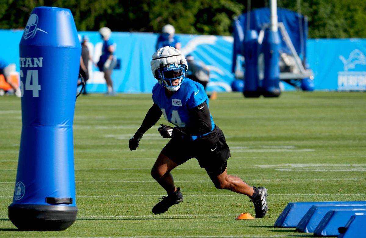 Detroit Lions WR Amon-Ra St. Brown runs a drill during training camp.