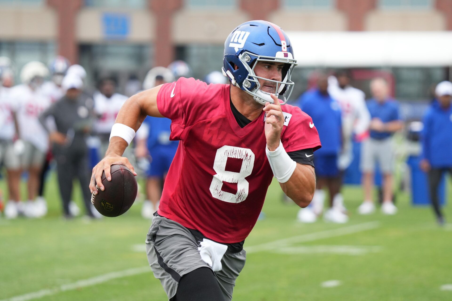 New York Giants QB Daniel Jones (8) scrambles during a play in training camp.