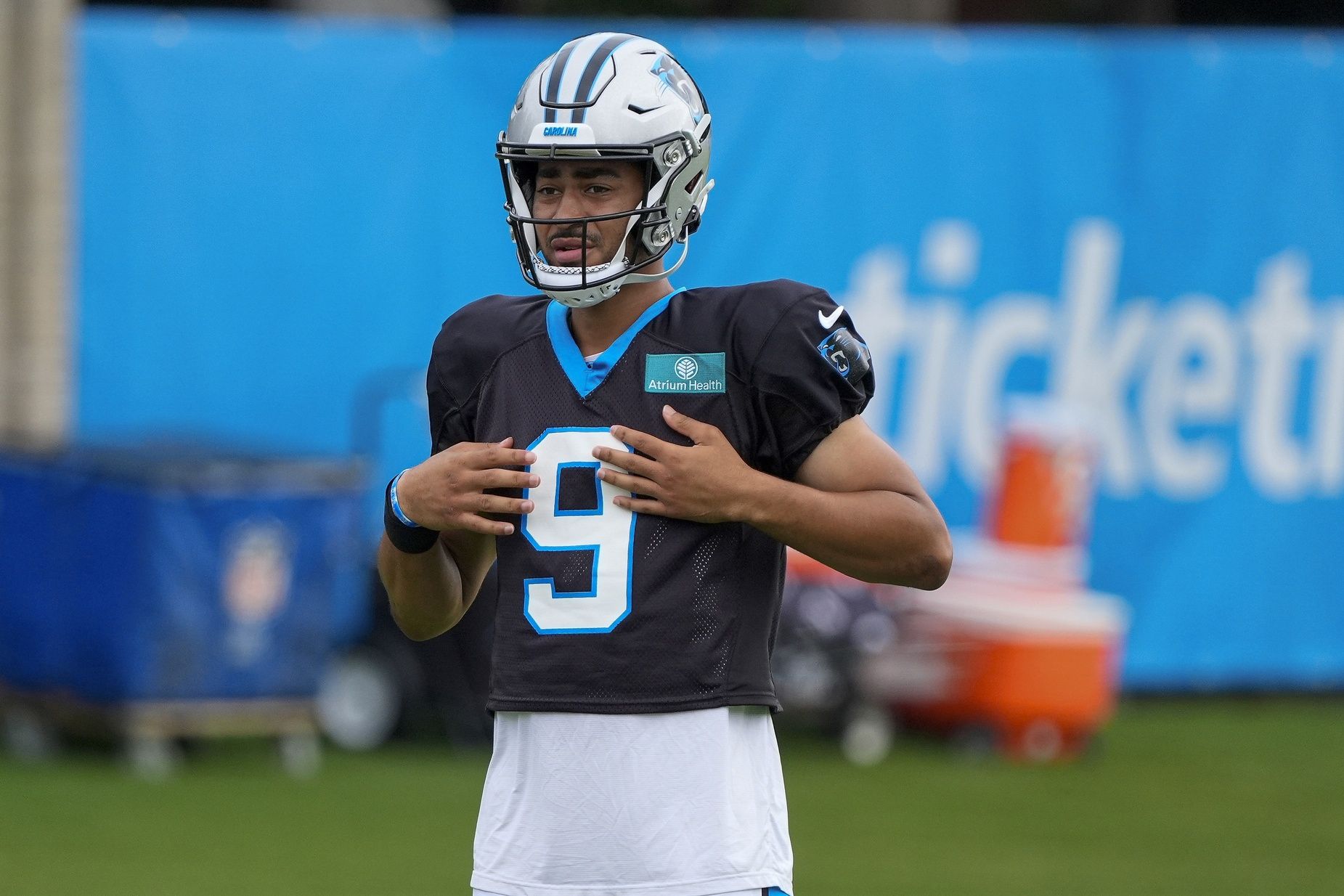 Carolina Panthers QB Bryce Young (9) looks on during training camp.