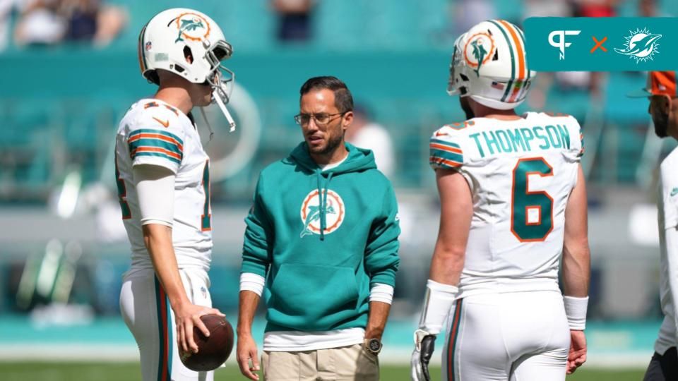 Miami Dolphins quarterback Skylar Thompson (19) and quarterback Mike White (14) warm up before a game against the Atlanta Falcons at Hard Rock Stadium.