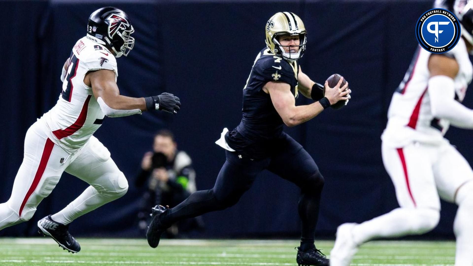 New Orleans Saints quarterback Taysom Hill (7) scrambles out the pocket and is tacked by Atlanta Falcons defensive tackle Calais Campbell (93) during the first half at Caesars Superdome. Mandatory Credit: Stephen Lew-USA TODAY Sports